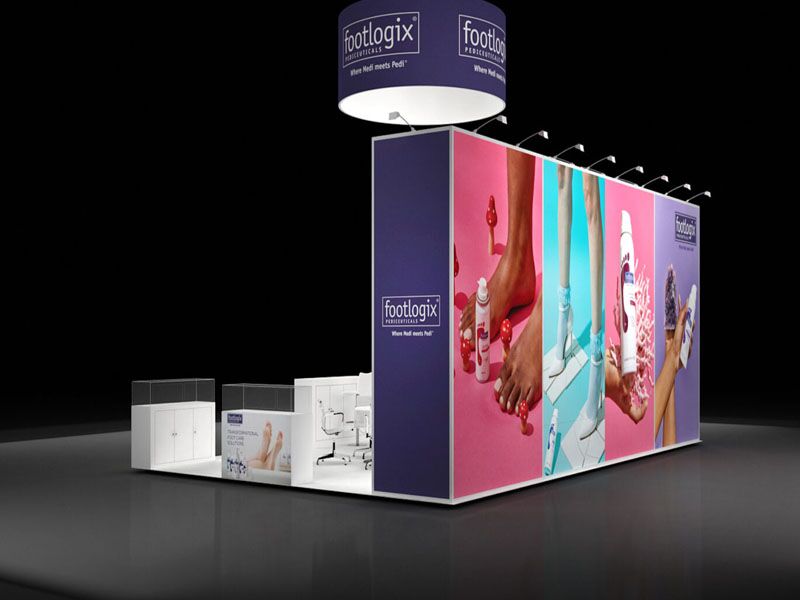 Compact booth design with a tall illuminated graphic wall and a hanging sign